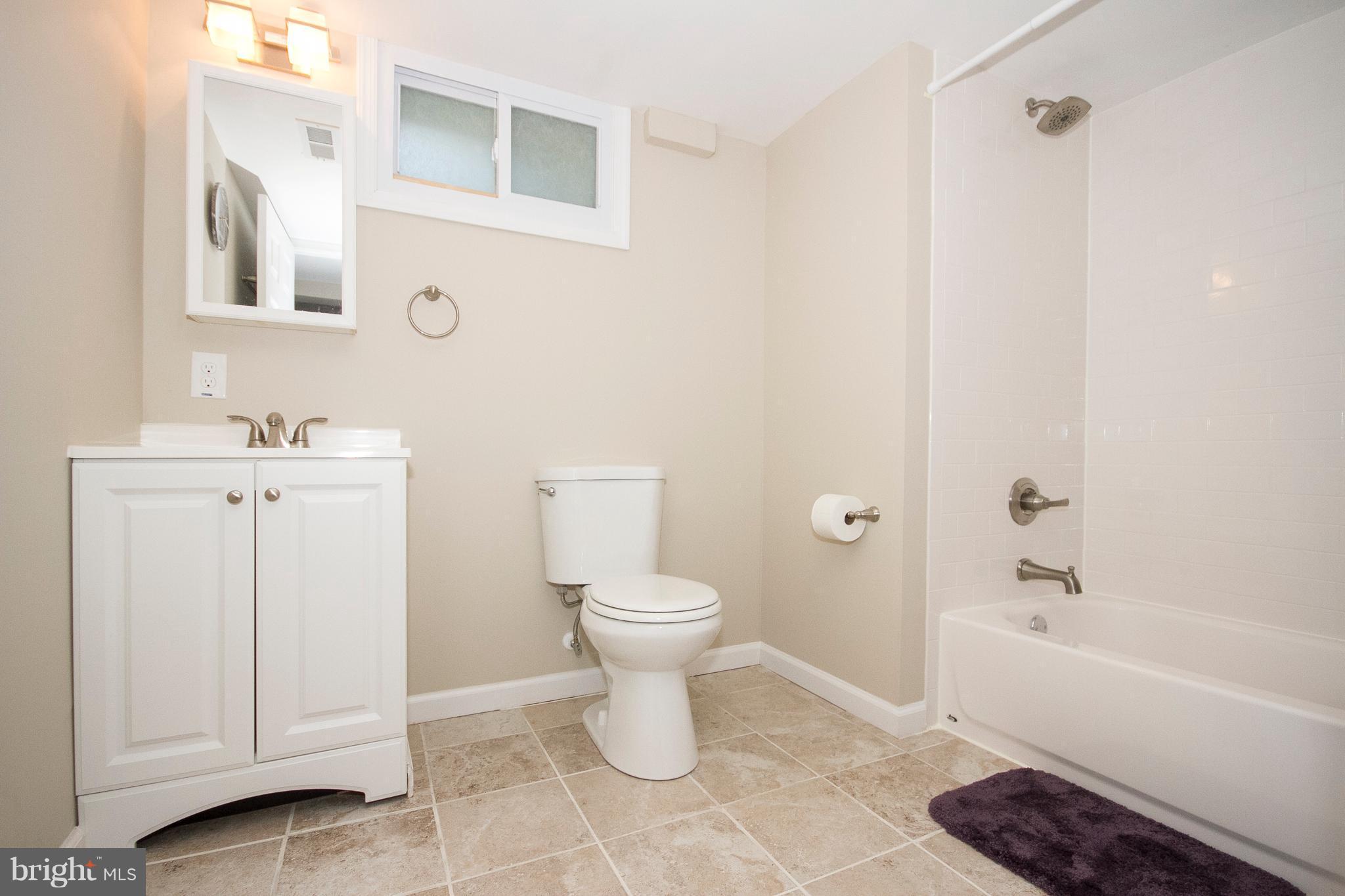 1618 Providence Road Towson, MD 21286 - Photo 20 of 30 a bathroom with a toilet sink and bathtub