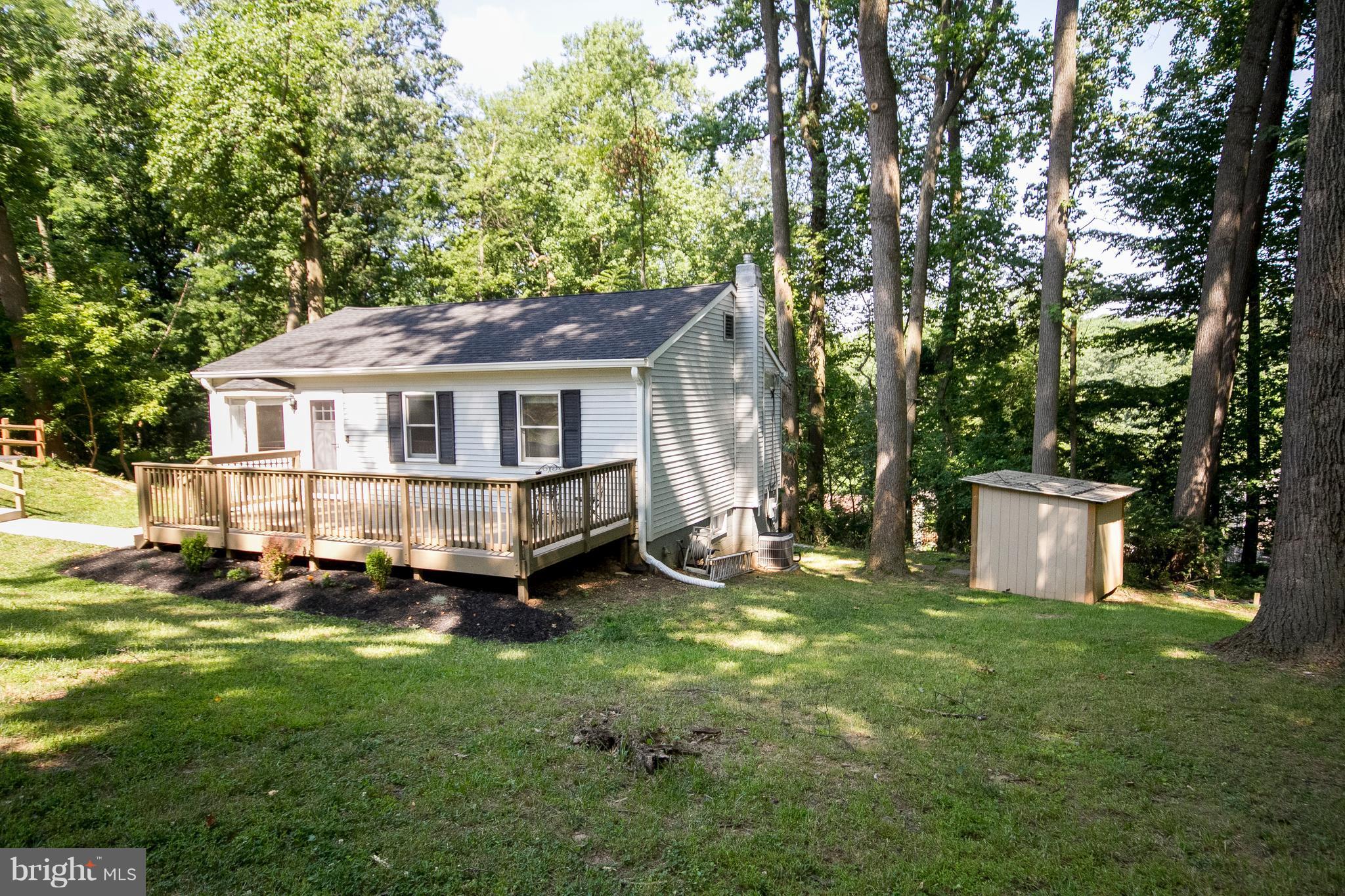 1618 Providence Road Towson, MD 21286 - Photo 5 of 30 a house with trees in front of it