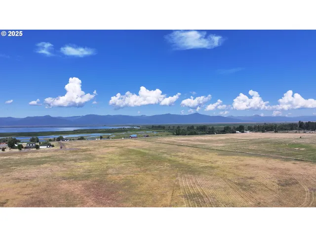 a view of a room with a yard and mountain view