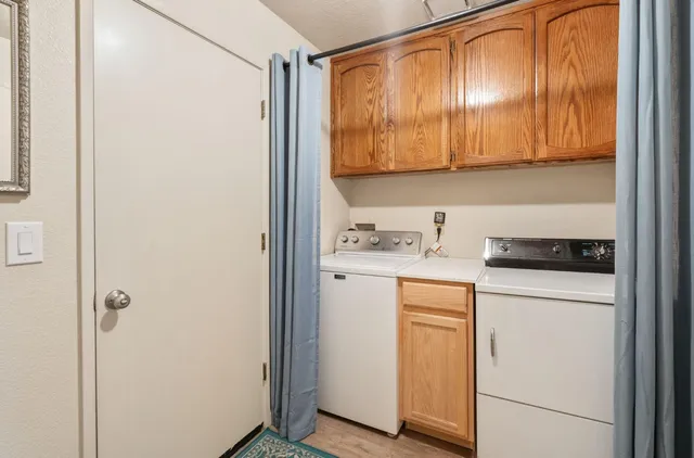 a view of cabinets and wooden floor