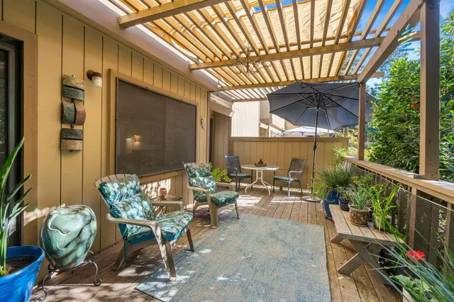 a view of an chairs and table in the balcony