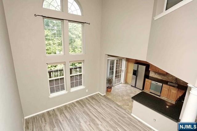 387 Green Mountain Road Mahwah, NJ 07430 - Photo 12 of 25 a view of a balcony with wooden floor and stairs