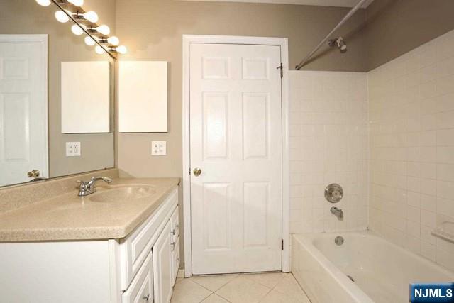 387 Green Mountain Road Mahwah, NJ 07430 - Photo 16 of 25 a bathroom with a tub sink and mirror
