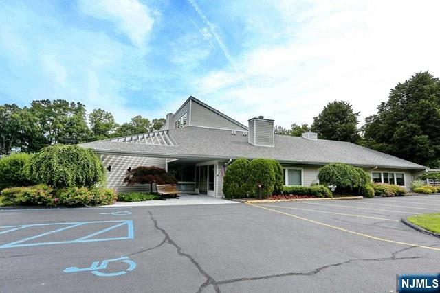 387 Green Mountain Road Mahwah, NJ 07430 - Photo 20 of 25 a front view of a house with a yard