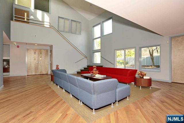 387 Green Mountain Road Mahwah, NJ 07430 - Photo 21 of 25 a living room with furniture and a floor to ceiling window
