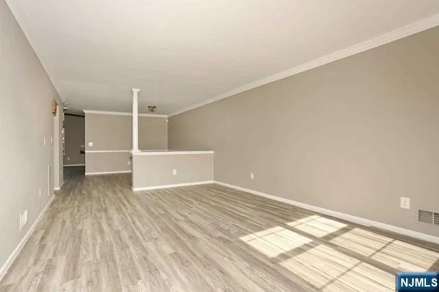 a view of an empty room and a window