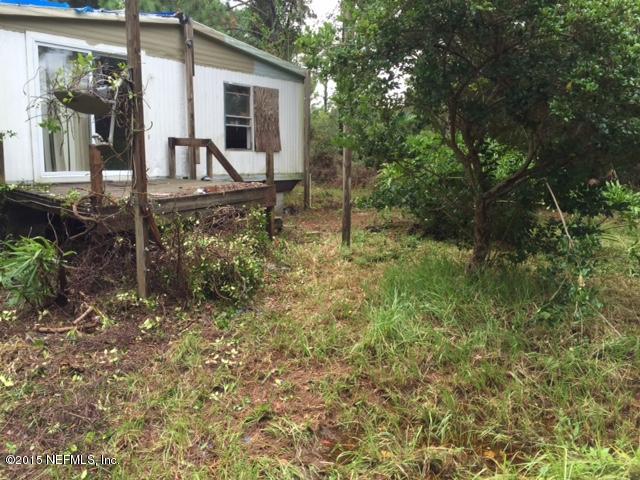 10319 Shellcracker Road Jacksonville, FL 32226 - Photo 9 of 10 a backyard of a house with seating space