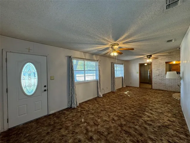a view of a hallway with windows