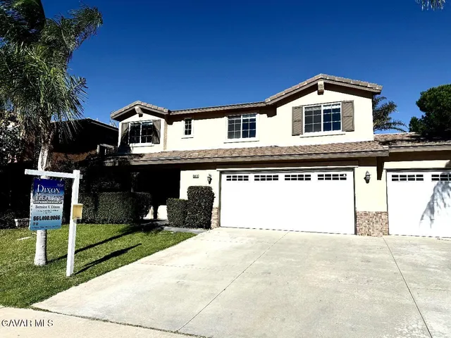 a front view of a house with yard
