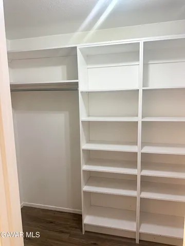 a bathroom with a tub shower and a sink