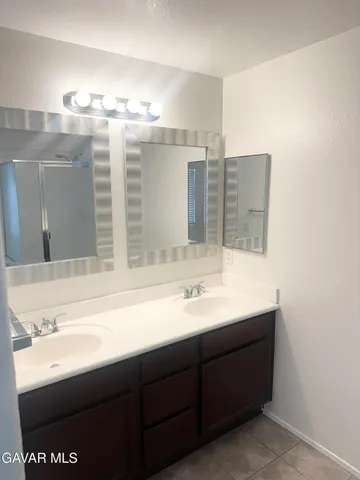 a white toilet sitting next to a shower