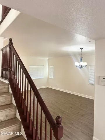 a view of a hallway with bathroom