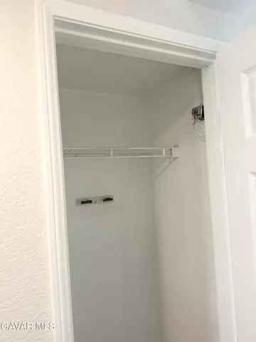 a kitchen with granite countertop a stove and cabinets