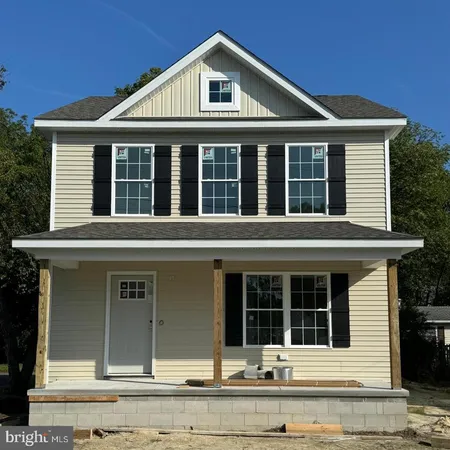 front view of a house with a small yard