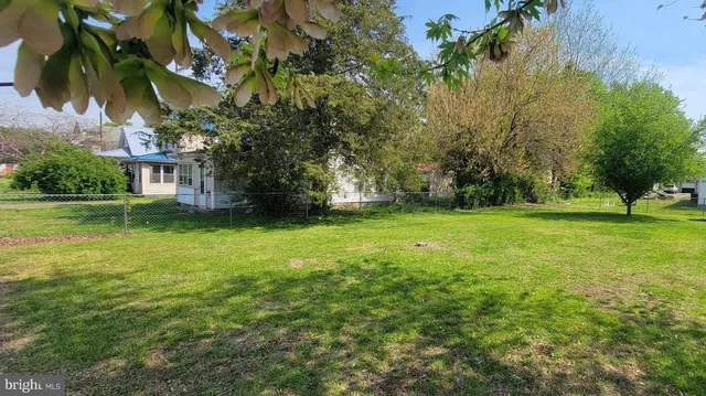 a view of a garden with a building