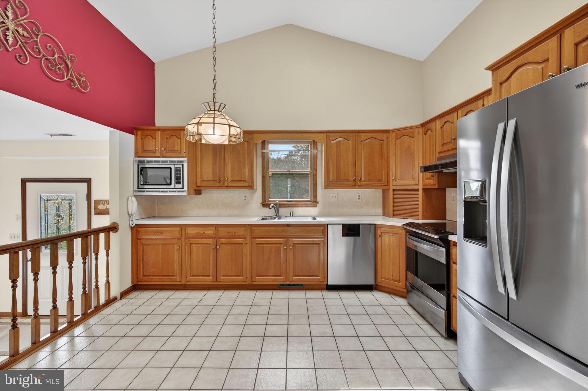 1703 Brickhouse Lane Fallston, MD 21047 - Photo 13 of 43 a kitchen with a refrigerator a sink dishwasher and a stove