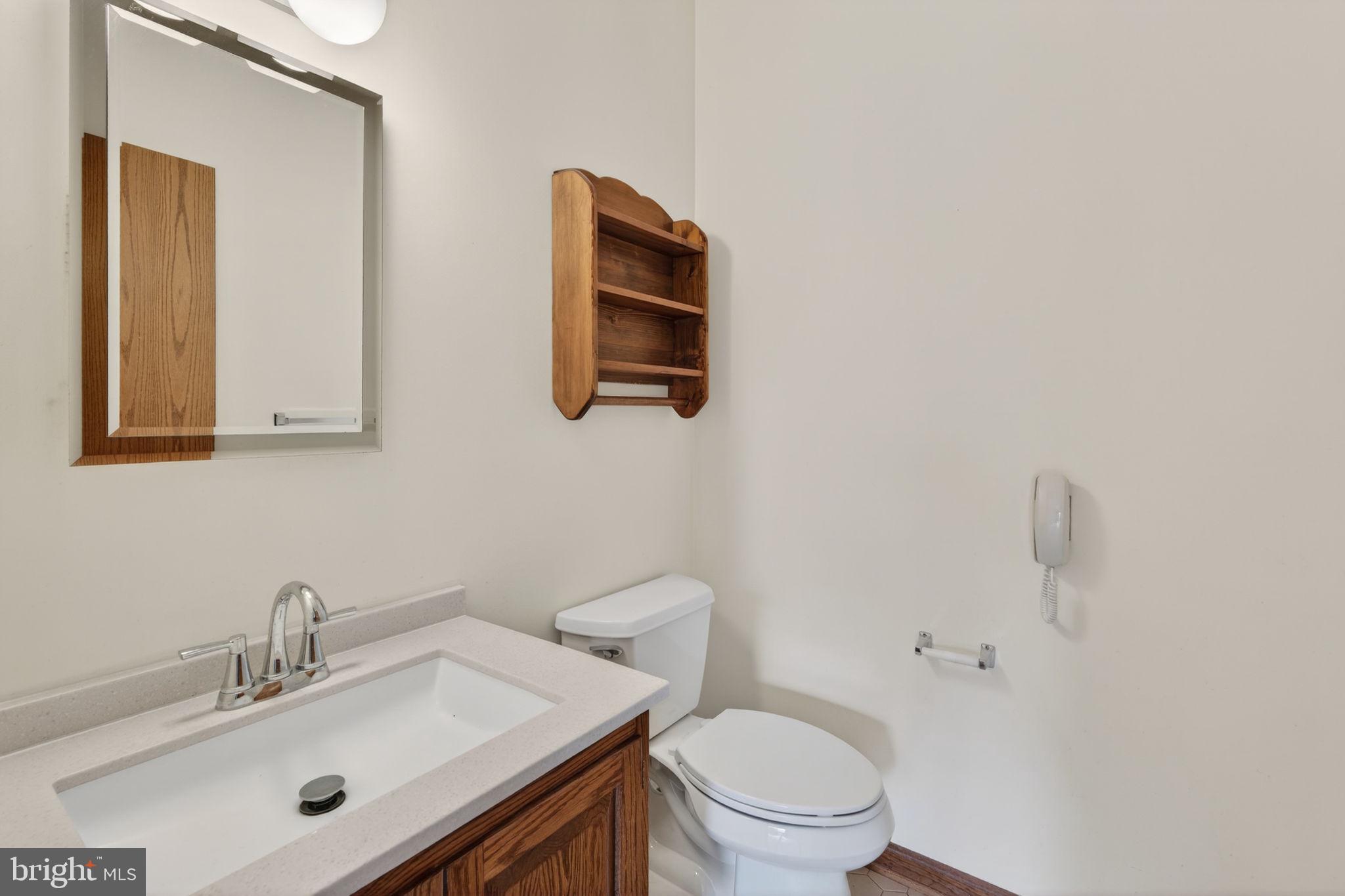 1703 Brickhouse Lane Fallston, MD 21047 - Photo 31 of 43 a bathroom with a sink mirror and toilet