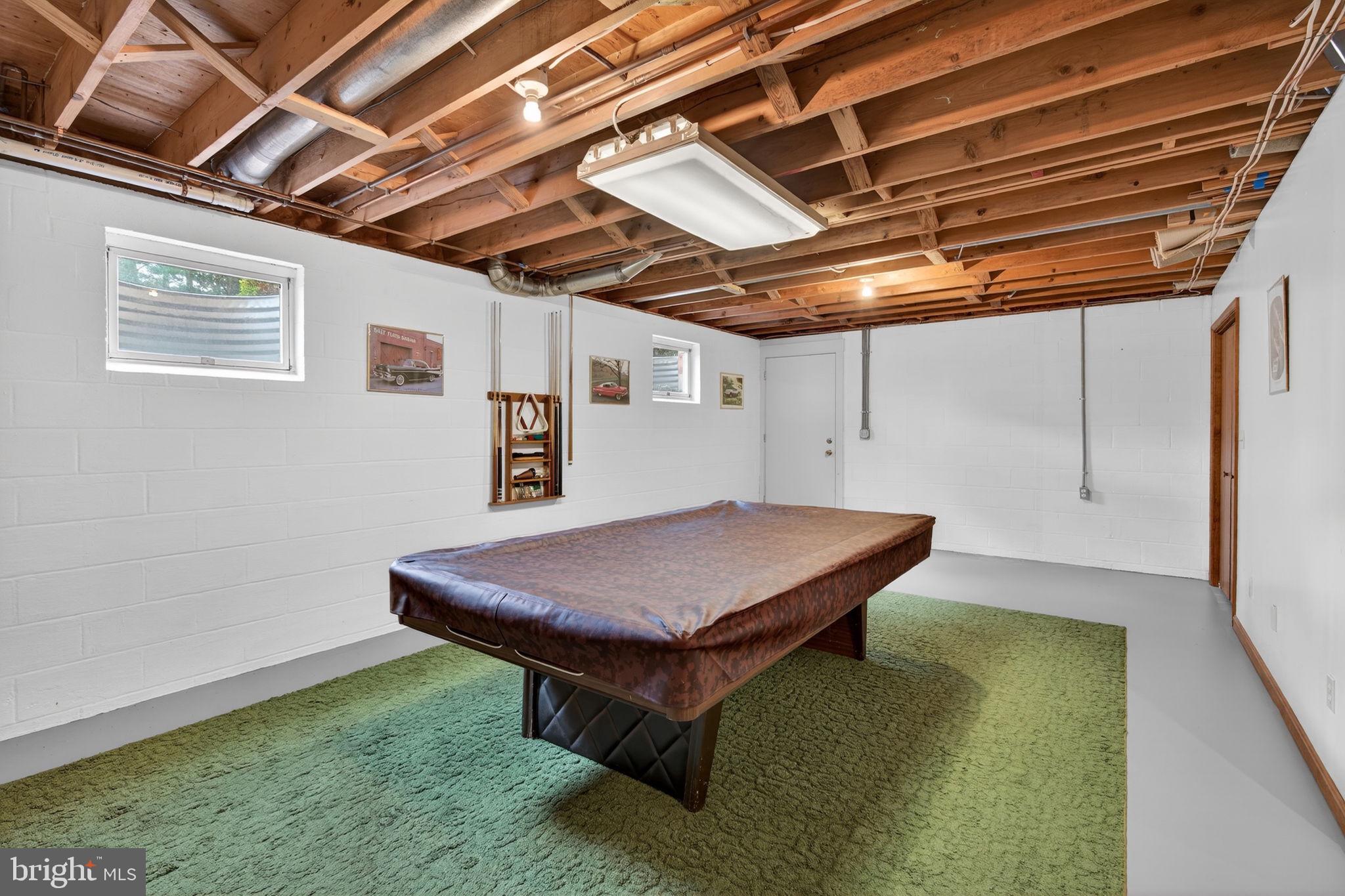 1703 Brickhouse Lane Fallston, MD 21047 - Photo 34 of 43 a room with pool table and a wooden floor