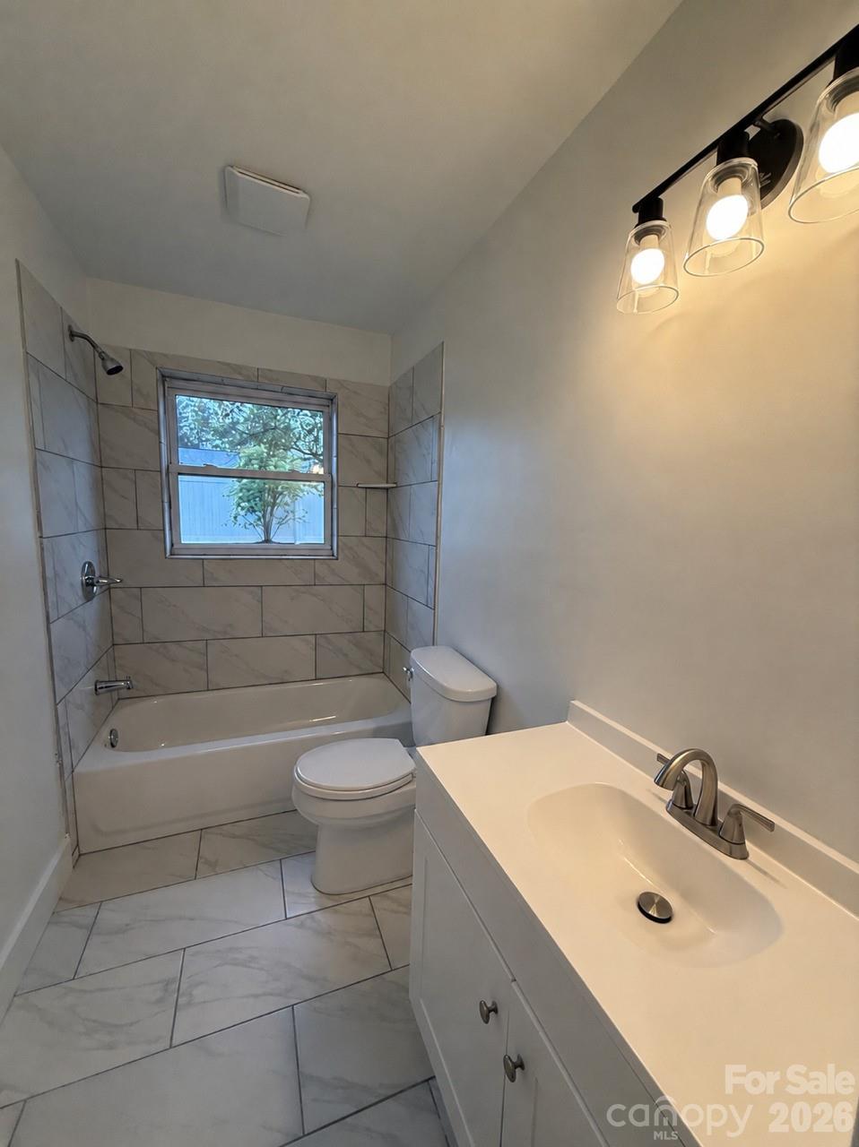 2677 Pax Hill Road Morganton, NC 28655 - Photo 8 of 15 a bathroom with a sink a toilet and bathtub