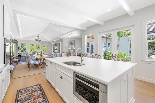 a view of kitchen with windows and chandelier
