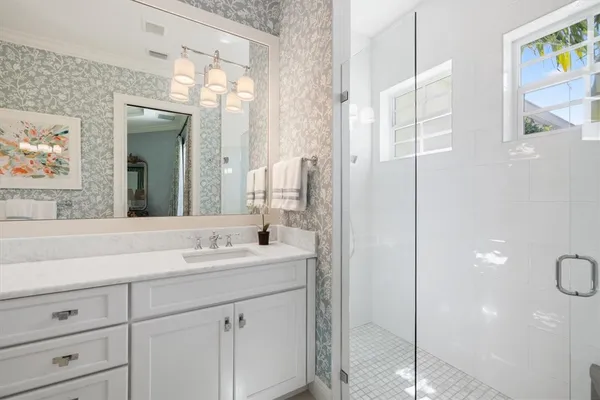a bathroom with a sink and a mirror