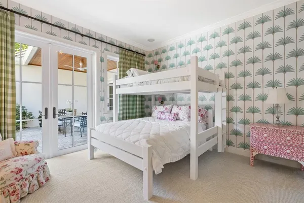 a bedroom with a bed and a table