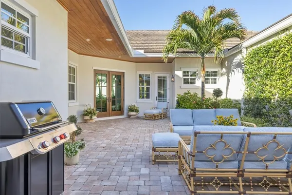 a view of a chairs and table in a patio