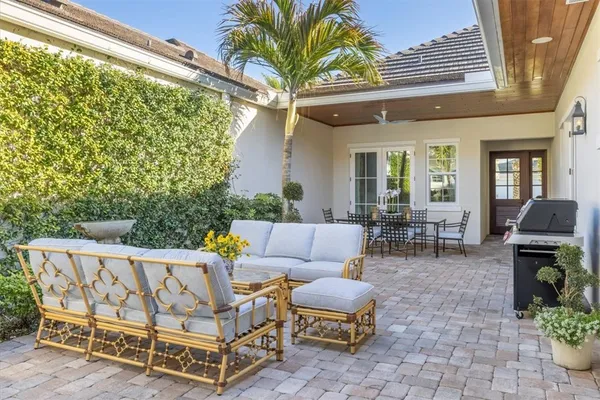 a outdoor living space with furniture and a potted plant