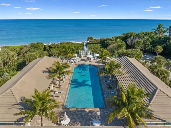 a view of a swimming pool with a patio