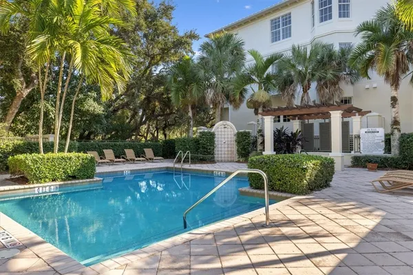 a view of a swimming pool with a patio