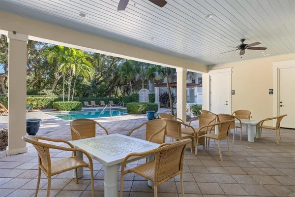 a outdoor space with patio the couches and dining table with a large window