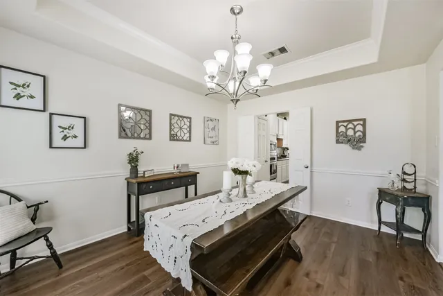 a bedroom with a bed and a table in it