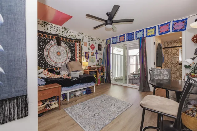 a living room with furniture and a book shelf
