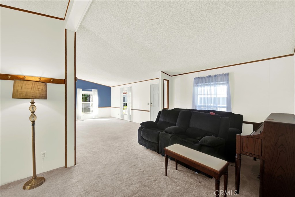 3835 Gardiner Ferry Road, Unit 31 Corning, CA 96021 - Photo 18 of 58 a living room with furniture and a window