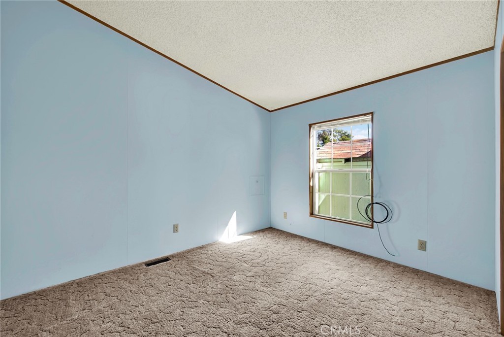 3835 Gardiner Ferry Road, Unit 31 Corning, CA 96021 - Photo 20 of 58 an empty room with windows