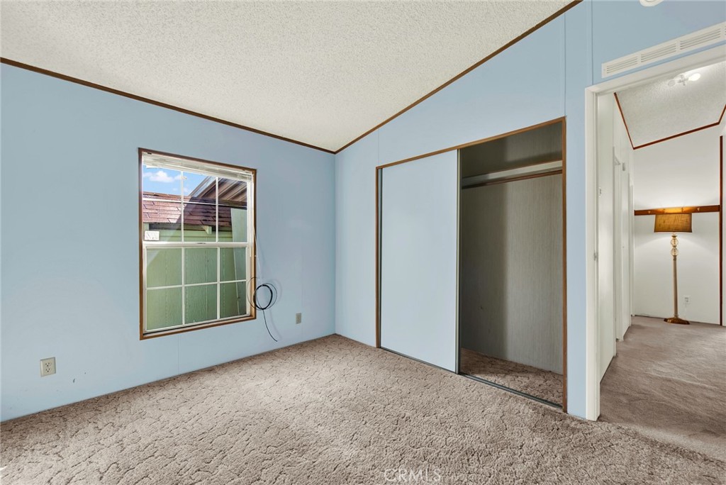 3835 Gardiner Ferry Road, Unit 31 Corning, CA 96021 - Photo 21 of 58 an empty room with windows and closet