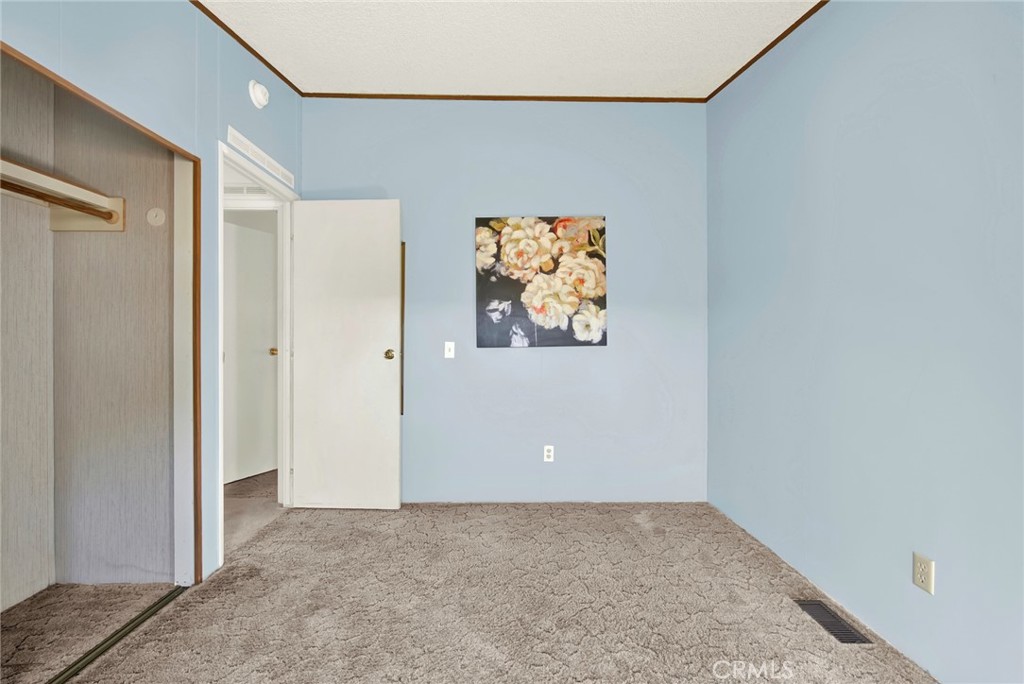 3835 Gardiner Ferry Road, Unit 31 Corning, CA 96021 - Photo 22 of 58 an empty room with painting on the wall