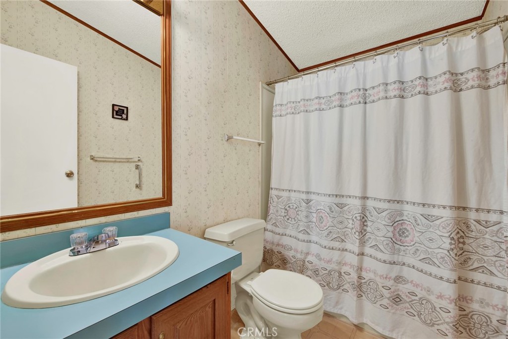 3835 Gardiner Ferry Road, Unit 31 Corning, CA 96021 - Photo 23 of 58 a bathroom with a sink toilet and shower