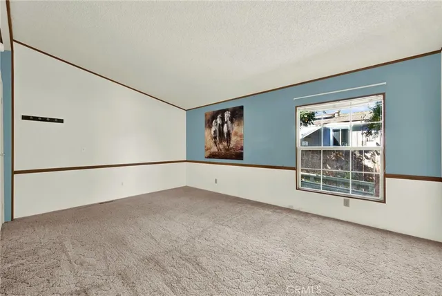 a large kitchen with cabinets and stainless steel appliances
