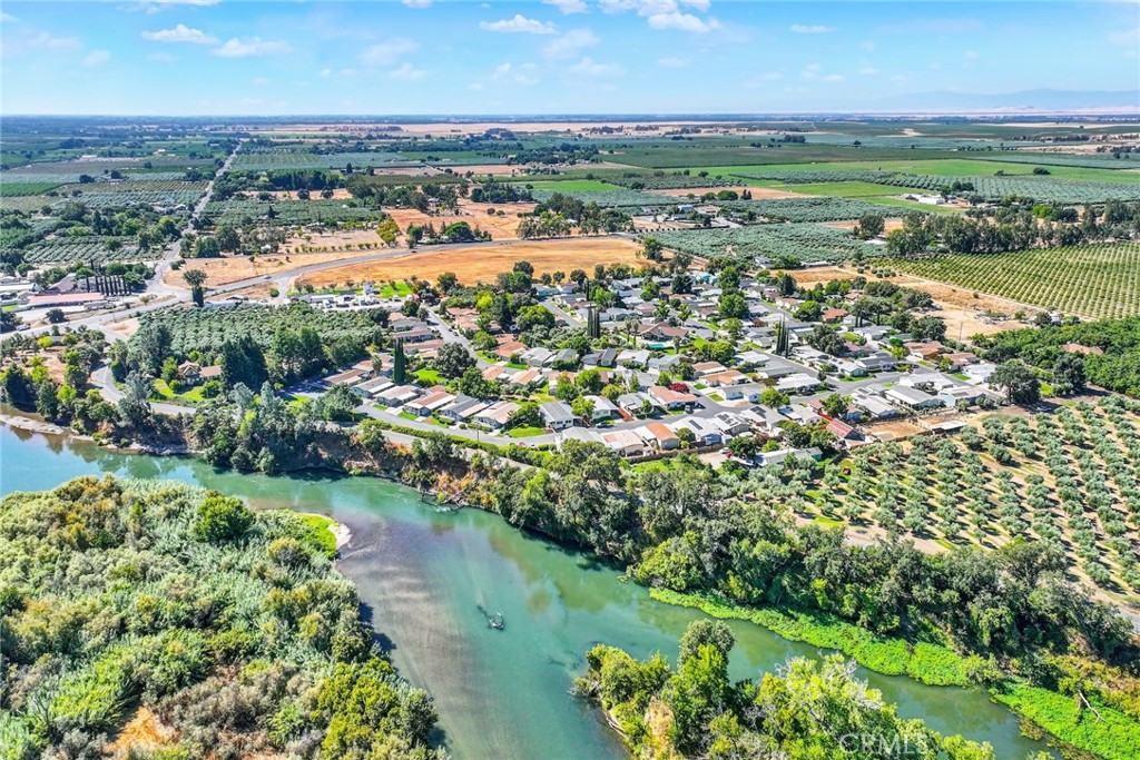 3835 Gardiner Ferry Road, Unit 31 Corning, CA 96021 - Photo 40 of 58 an aerial view of a city with lots of residential buildings ocean and mountain view in back