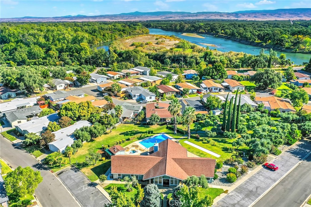 3835 Gardiner Ferry Road, Unit 31 Corning, CA 96021 - Photo 44 of 58 an aerial view of residential houses with outdoor space and swimming pool