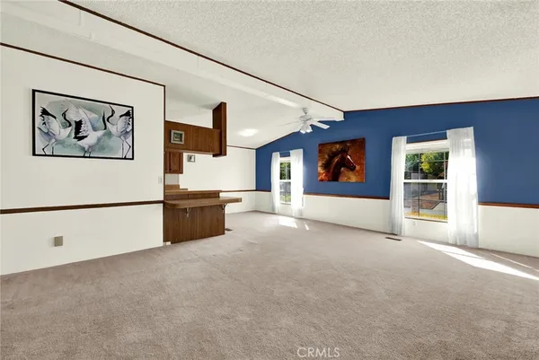a view of an empty room with a cabinet