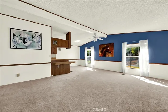 a view of an empty room with a cabinet