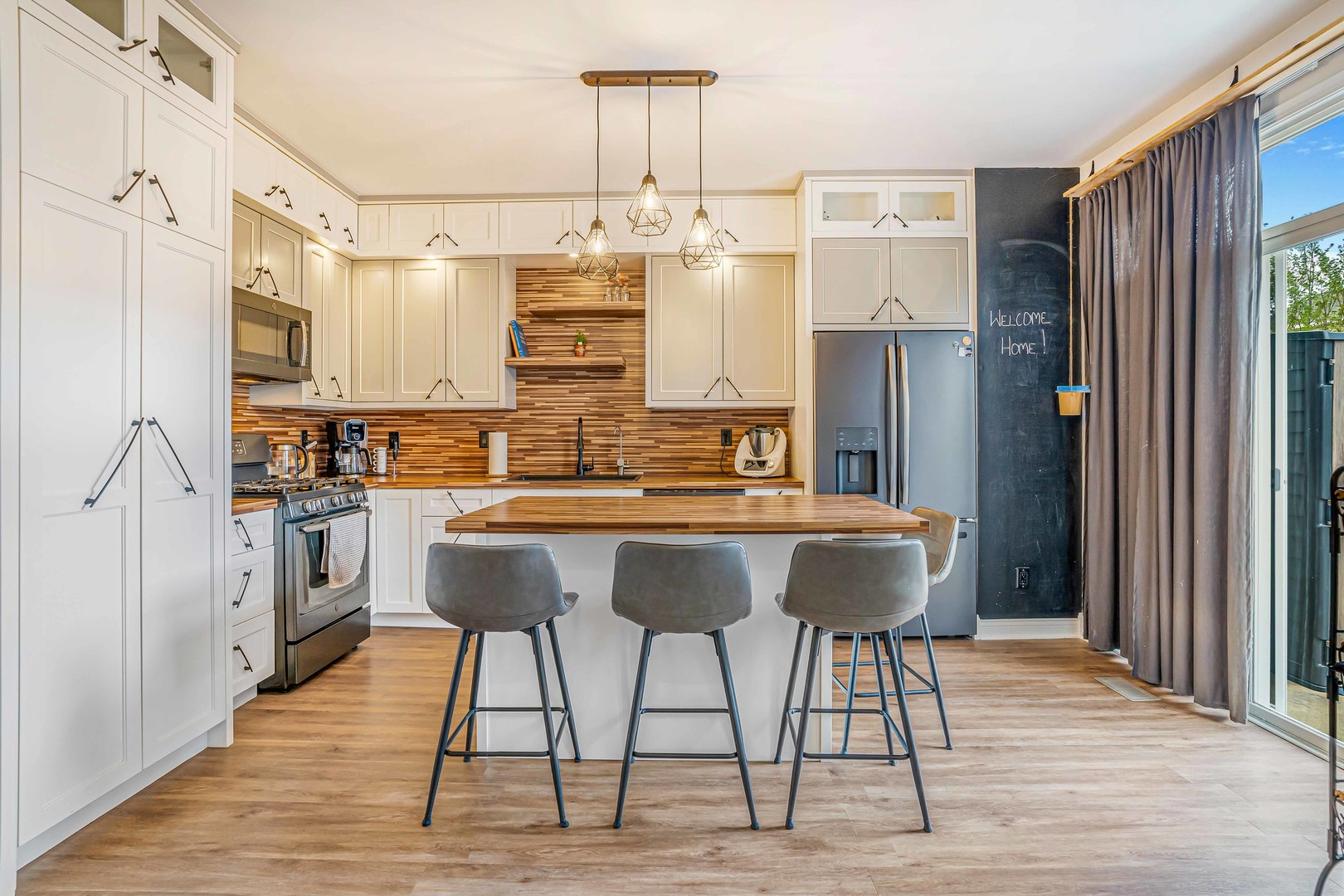684 Edward Drive Romeoville, IL 60446 - Photo 4 of 17 a kitchen with stainless steel appliances kitchen island granite countertop a refrigerator and a stove top oven
