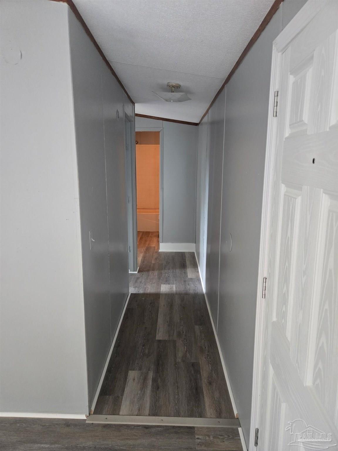 5675 Saufley Field Road, Unit 9 Pensacola, FL 32526 - Photo 7 of 15 a view of entryway with wooden floor