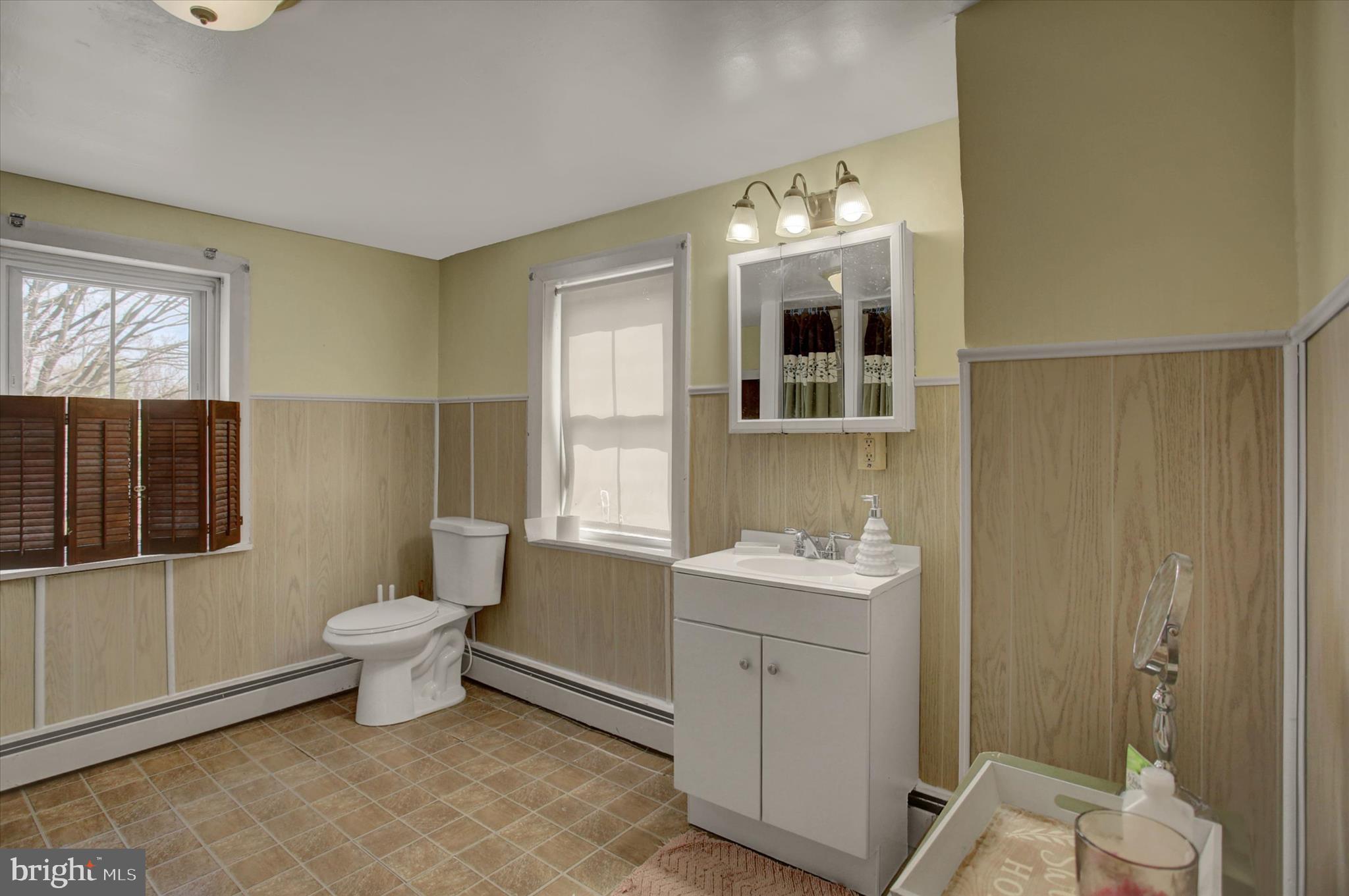 9775 Upper Strasburg Road Upperstrasburg, PA 17265 - Photo 19 of 35 a bathroom with a sink toilet and shower