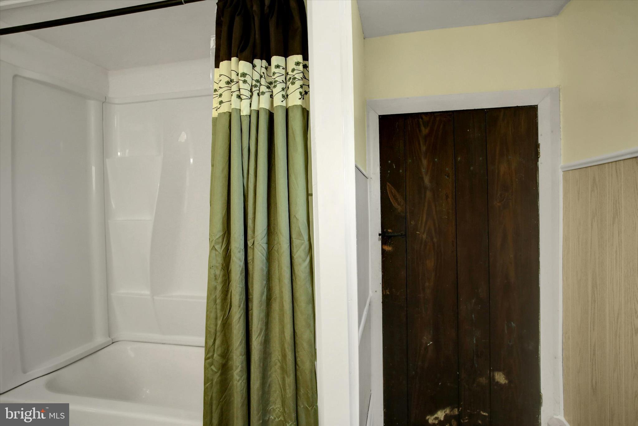 9775 Upper Strasburg Road Upperstrasburg, PA 17265 - Photo 20 of 35 a bathroom with a mirror and a shower
