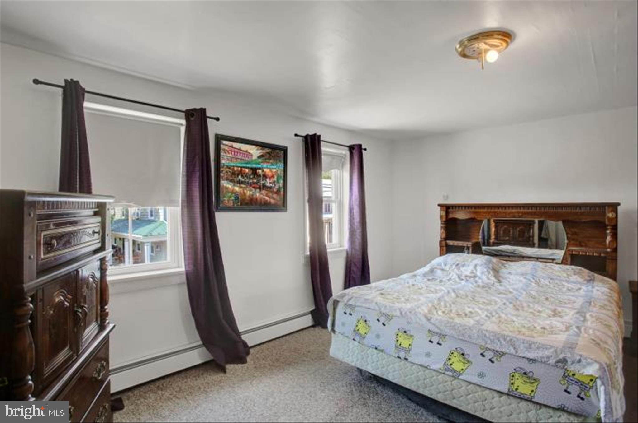 9775 Upper Strasburg Road Upperstrasburg, PA 17265 - Photo 23 of 35 a bedroom with a bed and a tv on the dresser