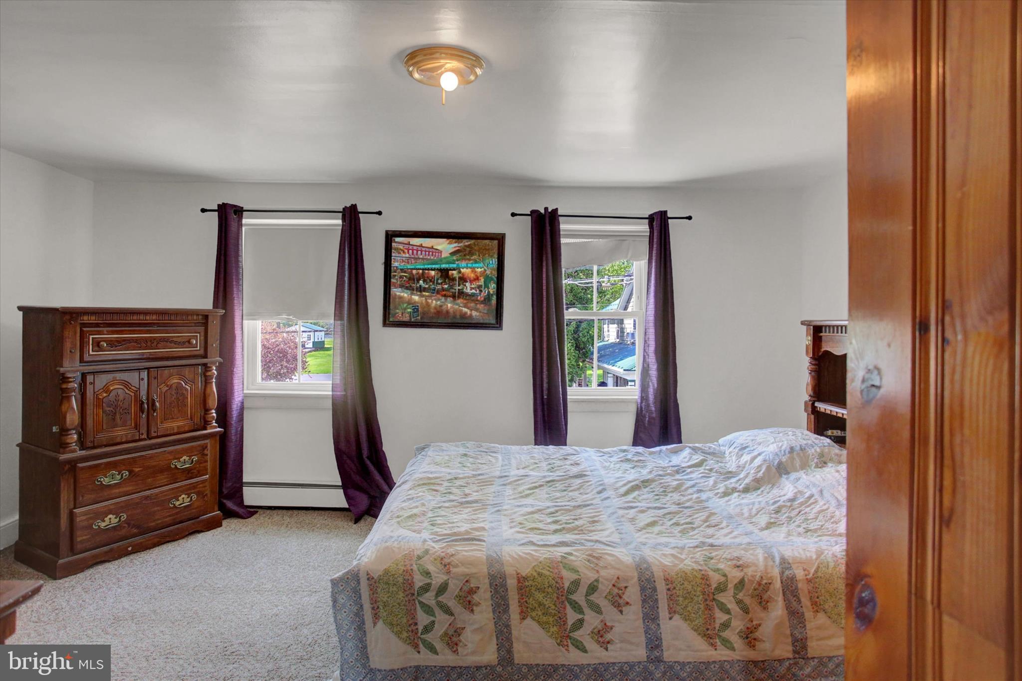 9775 Upper Strasburg Road Upperstrasburg, PA 17265 - Photo 24 of 35 a bedroom with a bed and a tv on the dresser