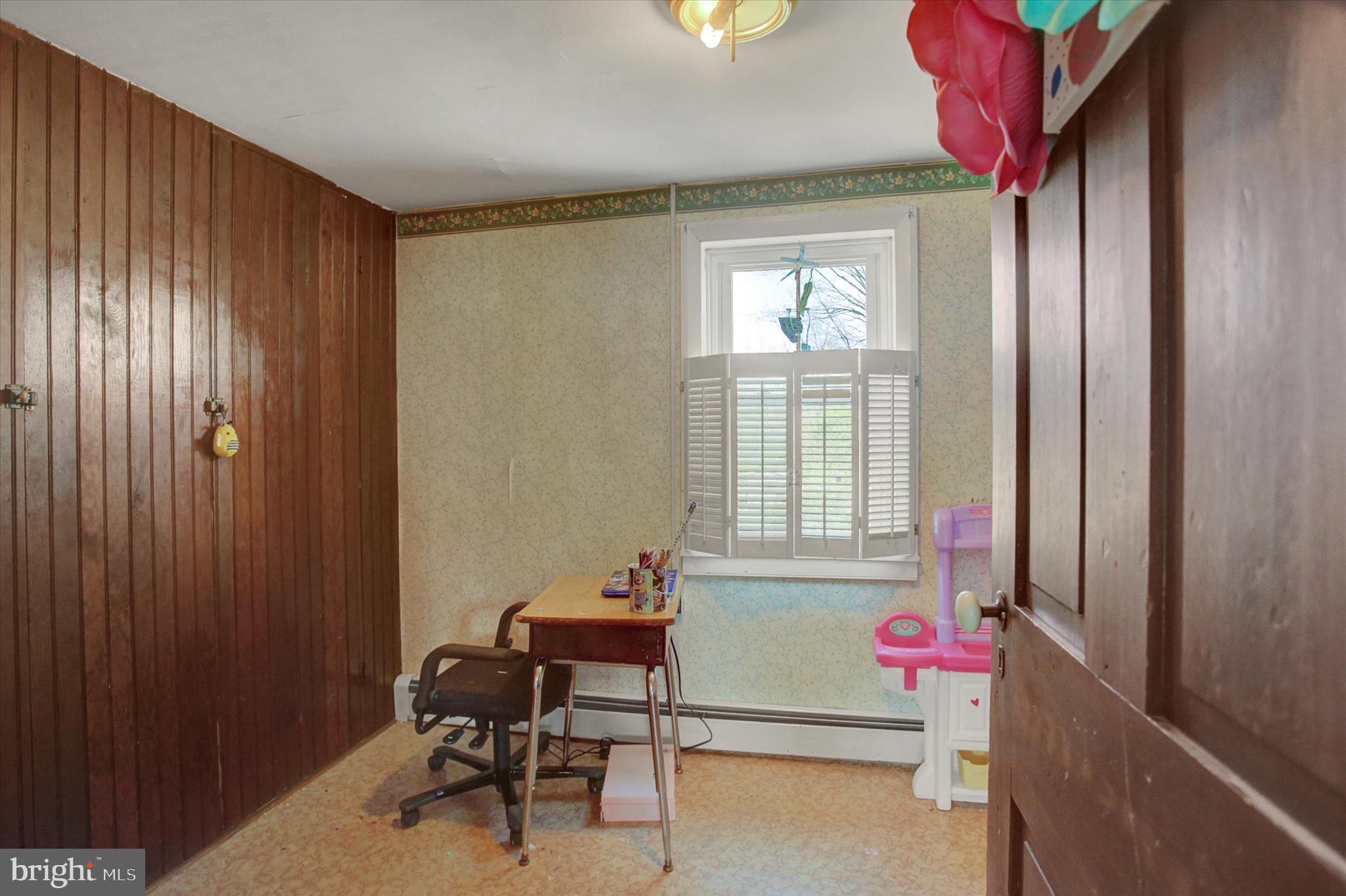 9775 Upper Strasburg Road Upperstrasburg, PA 17265 - Photo 25 of 35 a view of a room that has a window and a chair in it